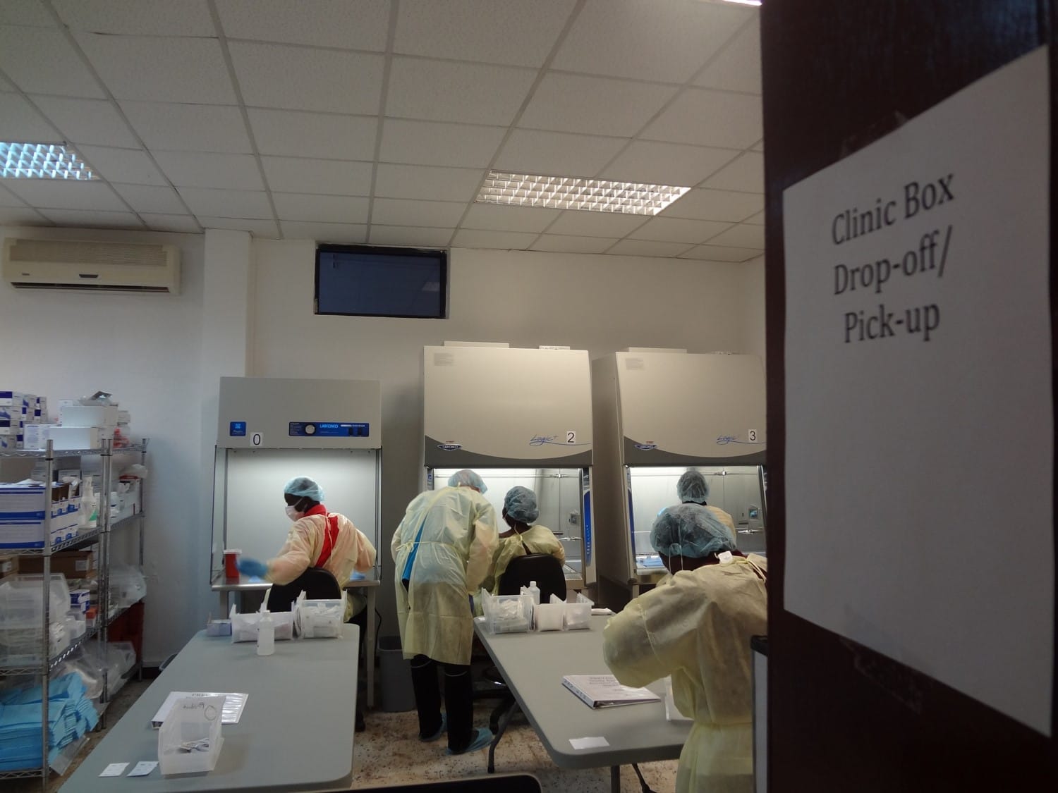 Pharmacists in protective gear transfer Ebola test vaccines from vials to syringes for the PREVAIL vaccine study at Redemption Hospital, Liberia (file photo, January 2016; not related to the Bundibugyo outbreak).
